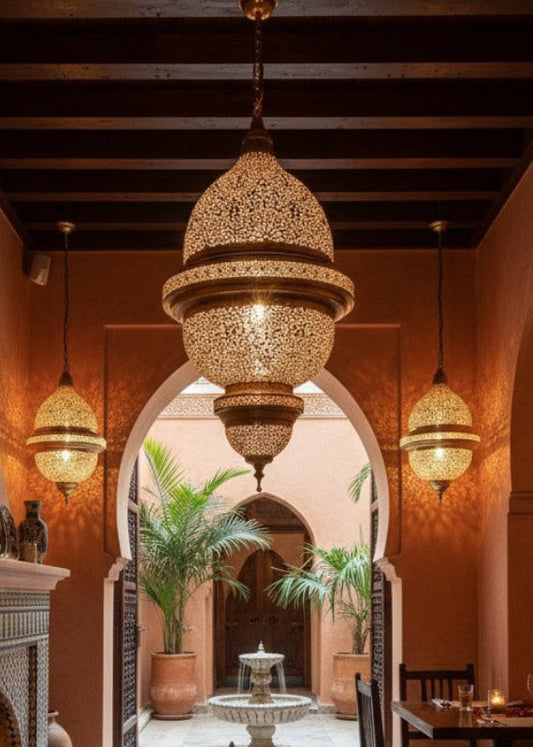 Decorative interior of a restaurant with ornate ceiling lights, tables set for dining, and a warm ambiance.