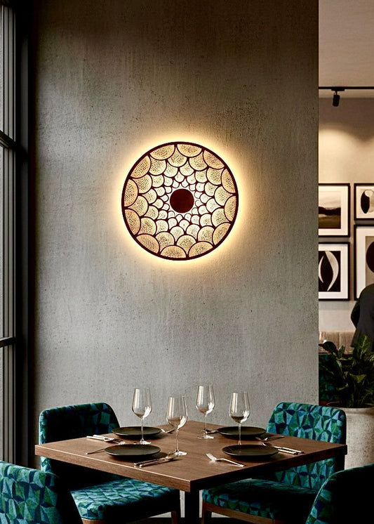 Antique brass Moroccan wall sconce, hand-engraved by artisans for a luxurious boho interior.