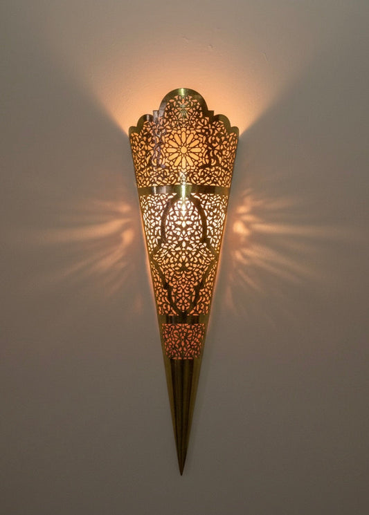 Handcrafted Moroccan brass wall lamp with intricate geometric patterns and warm golden finish.