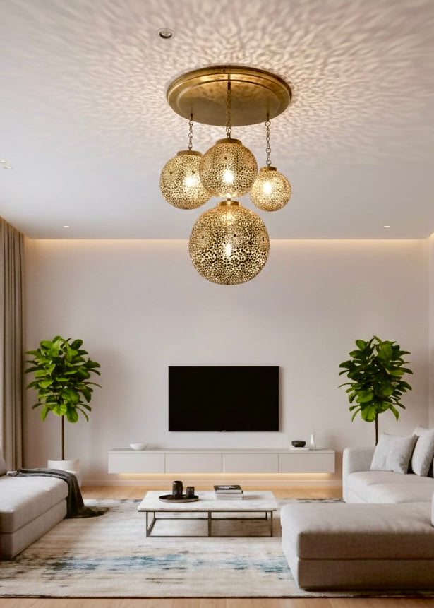 Elegant white living room with a coffered ceiling featuring a 4-globe Moroccan brass cluster pendant light.