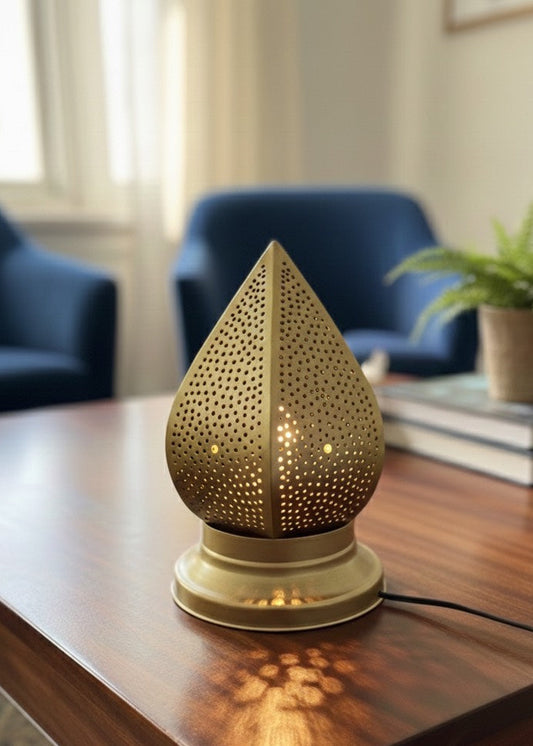 Elegant gold-finished Moroccan brass lamp on a coffee table with a modern interior