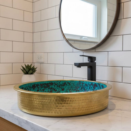 Detailed close-up of the hand-hammered texture on a gold brass sink showing artisan craftsmanship.