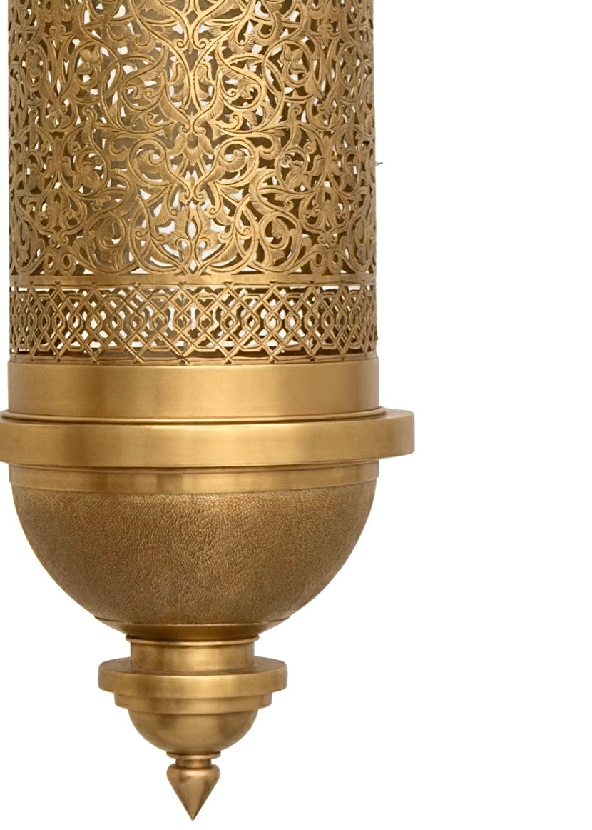 Extreme close-up of the hand-engraved details on a Moroccan brass lamp, showcasing traditional artisan craftsmanship.