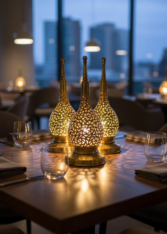Detailed view of the hand-cut geometric lattice work on a traditional Moroccan tea light holder.