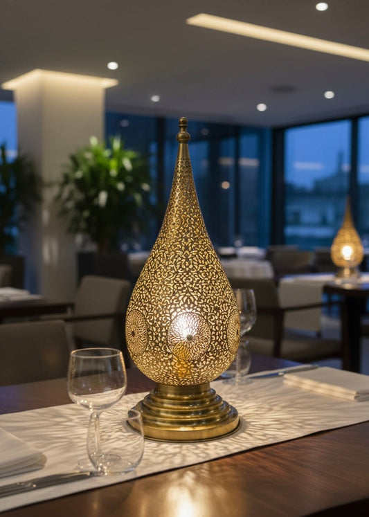 Close-up of the hand-pierced floral motifs and craftsmanship on a Moroccan brass lamp.