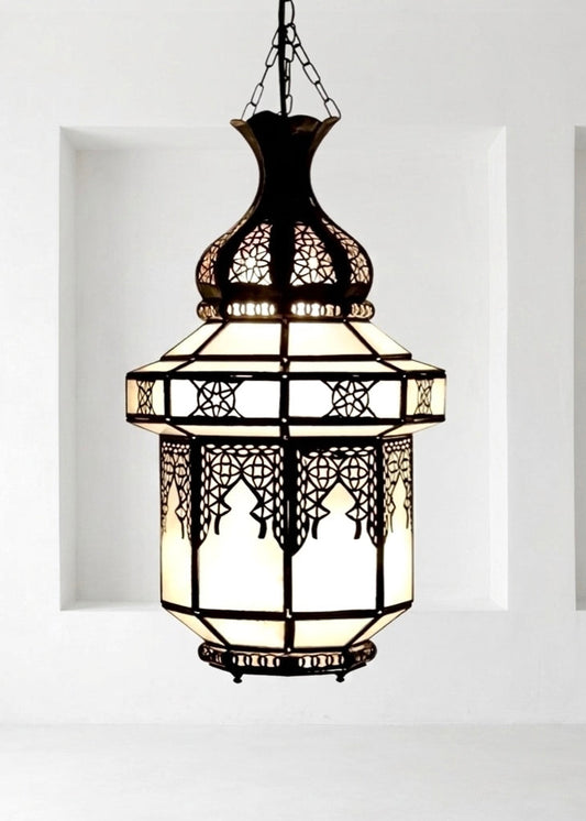 Detailed view of a handmade Moroccan pendant lamp with intricate brass and glass craftsmanship