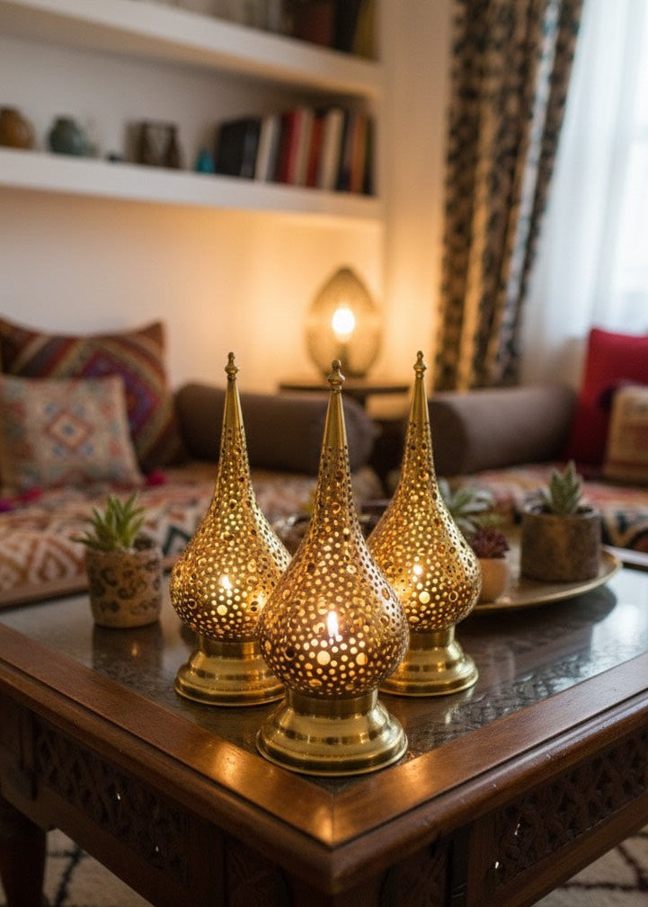 Decorative gold lanterns on a wooden coffee table in a living room.