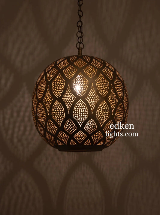 Handcrafted Moroccan brass pendant light in a spherical shape, featuring intricate hand-punched patterns.