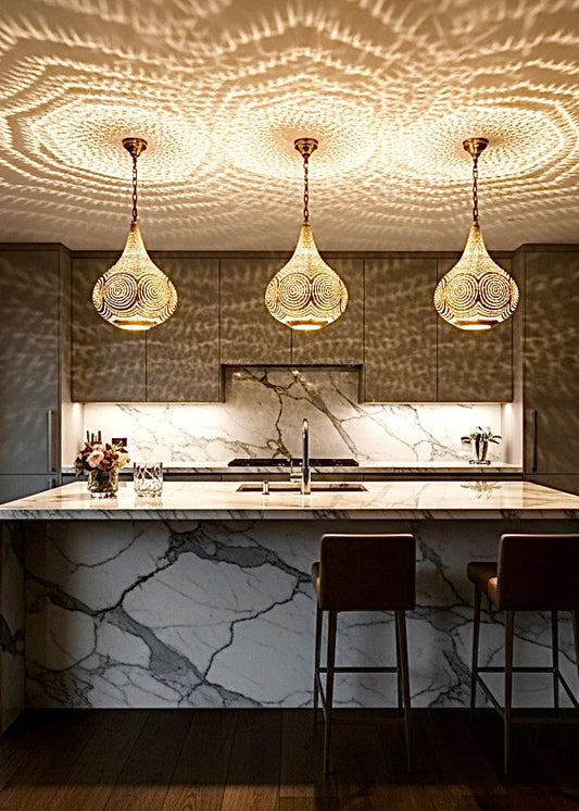 Mesmerizing geometric shadow patterns projected on a wall by a Moroccan pendant light, creating a bohemian atmosphere.
