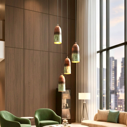 Creative cluster of four patina copper pendant lights in a high-ceiling modern living room