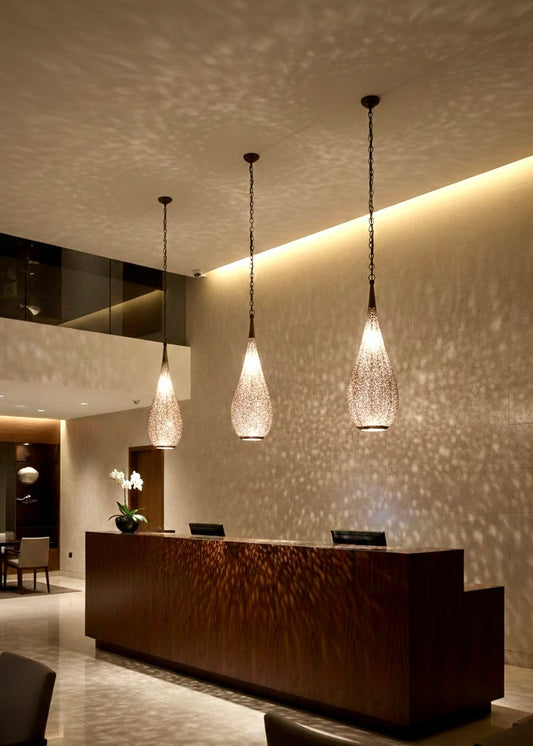 Silver-plated Moroccan brass pendant light, handcrafted filigree lamp for modern luxury interiors.