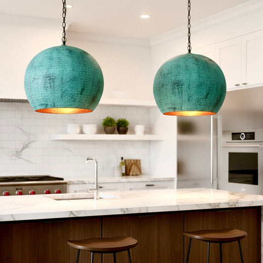 Verdigris green brass dome ceiling light providing a classic weathered look over a contemporary kitchen island.