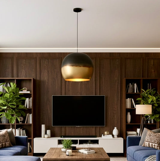 The interior view of a brass dome lamp reflecting warm light across a contemporary living space.