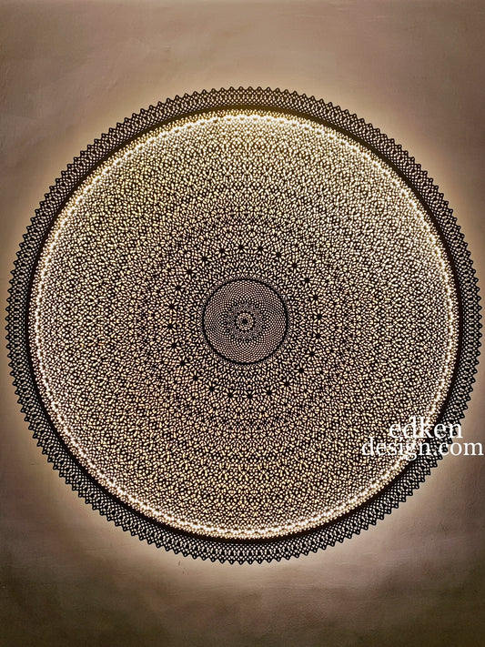 Detailed close-up of a handcrafted etched brass wall sconce, traditional Moroccan craftsmanship with sunburst light pattern, Edken lights.