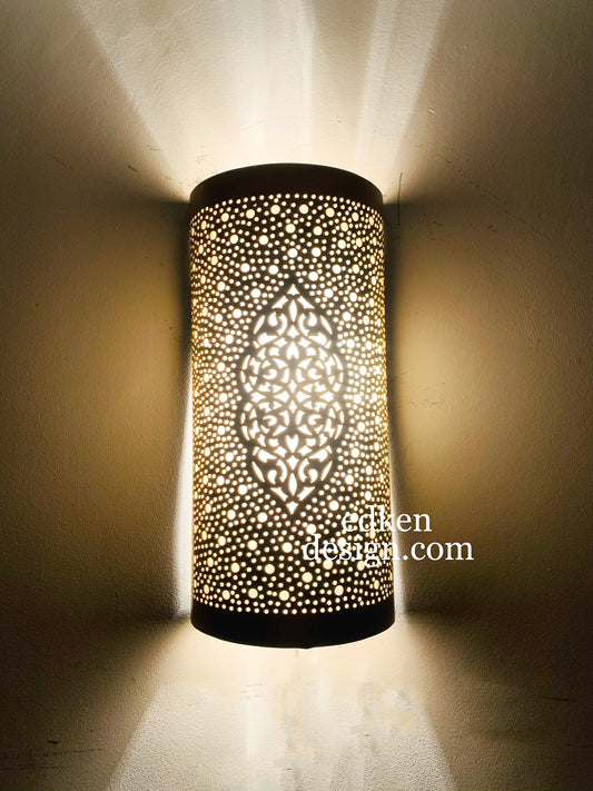 Modern cylindrical Moroccan wall sconce in brushed gold brass, featuring hand-pierced floral and dot patterns.