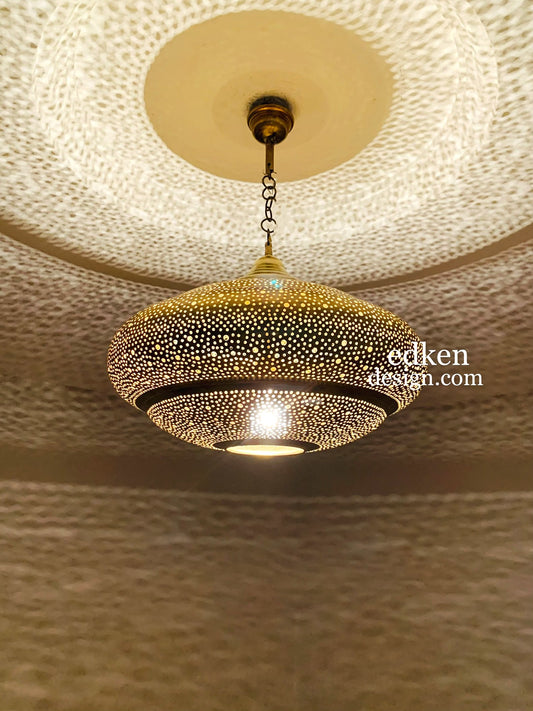 Authentic Moroccan brass ceiling lamp with a teardrop shape and traditional hand-carved patterns.