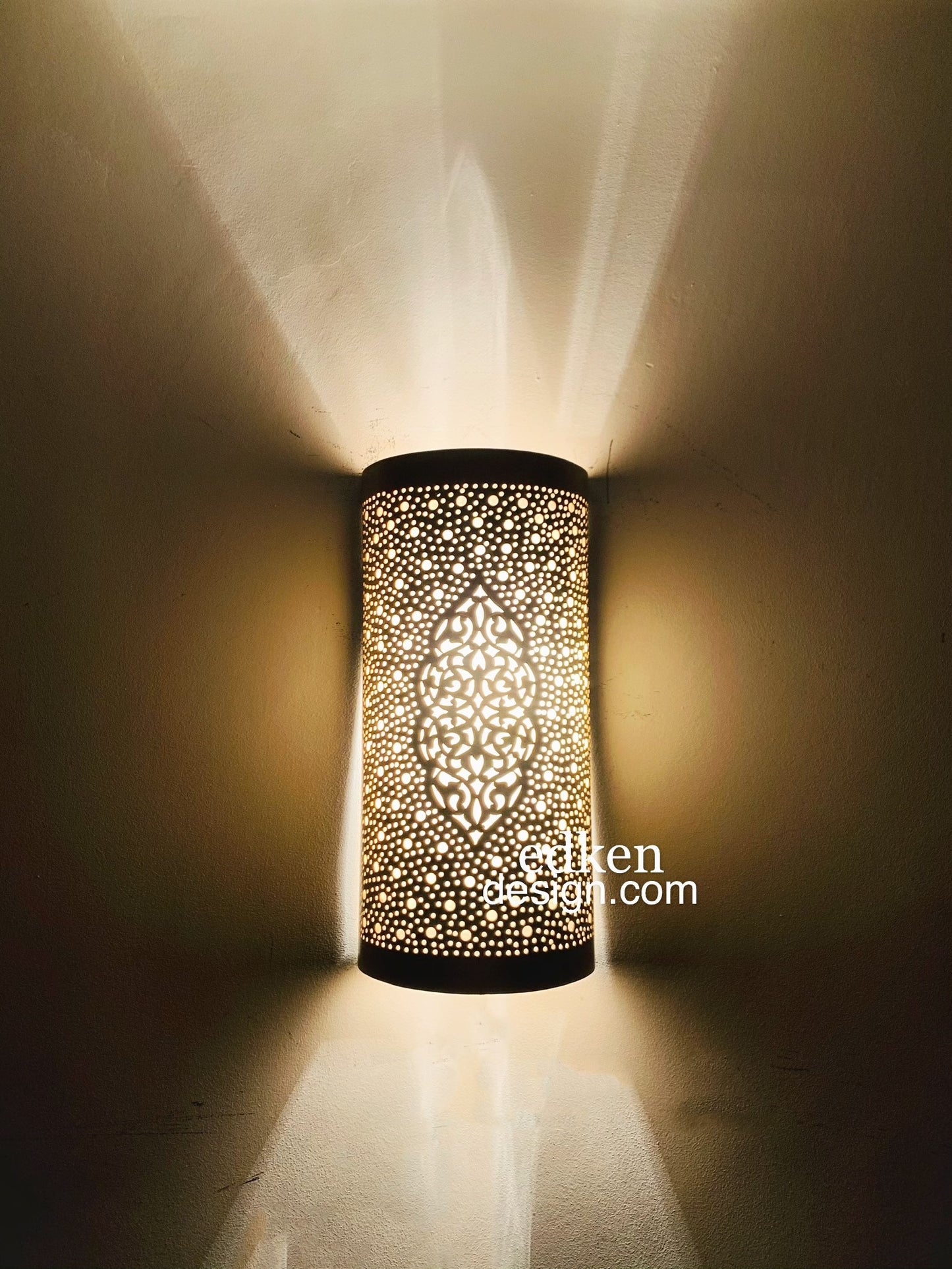 Close-up of the 100% handmade brass craftsmanship showing the fine perforated metalwork of the sconce.