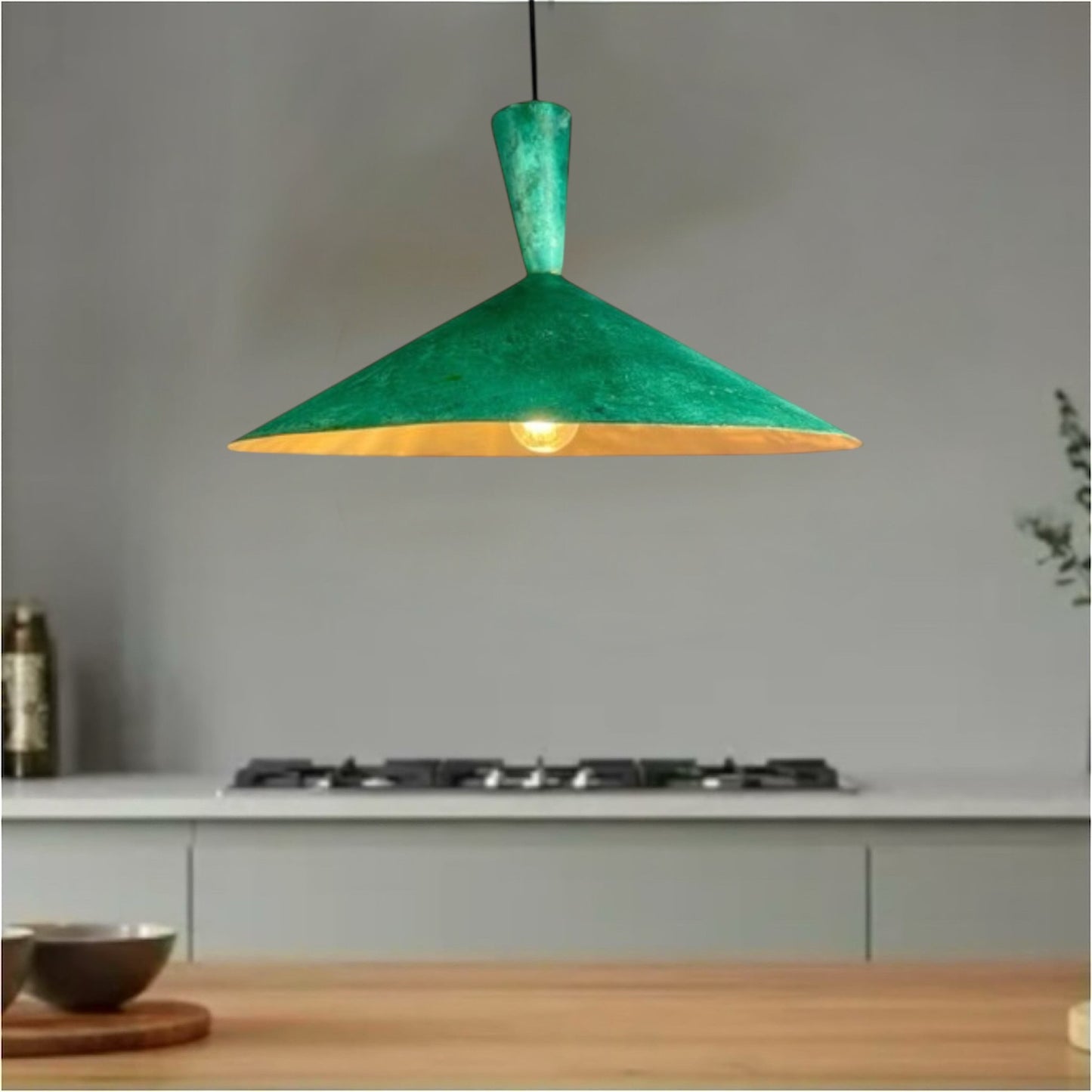 Minimalist kitchen decor featuring a handmade green brass dome pendant lamp