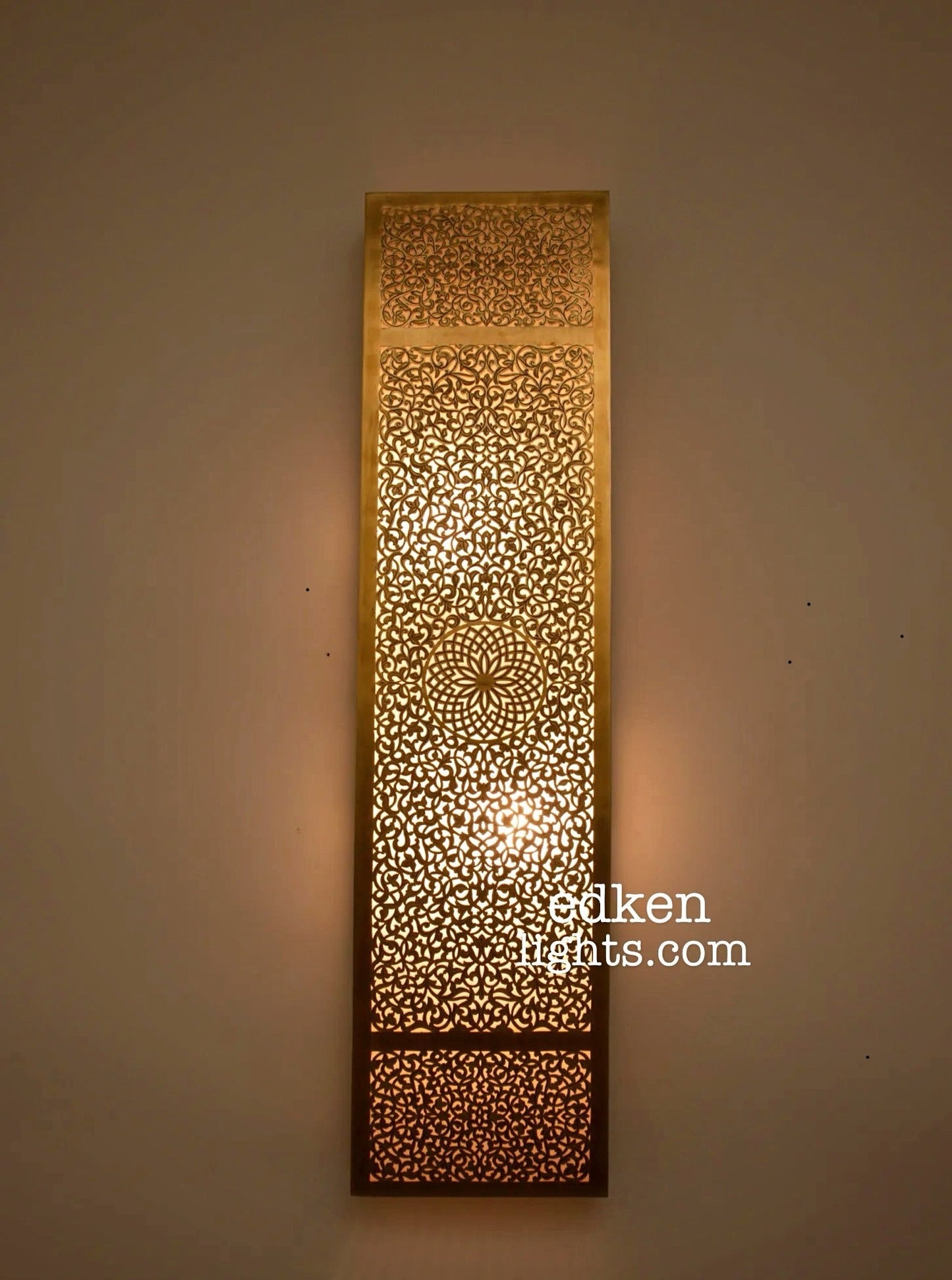 Close-up detail of handmade Moroccan brass wall lamp showing intricate traditional craftsmanship