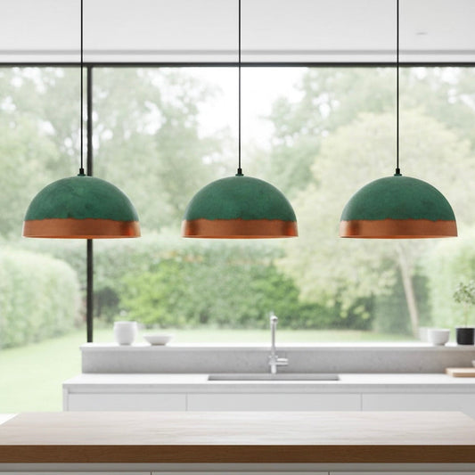 Detail of the adjustable black cable and top mount of the green patina copper ceiling lamp.