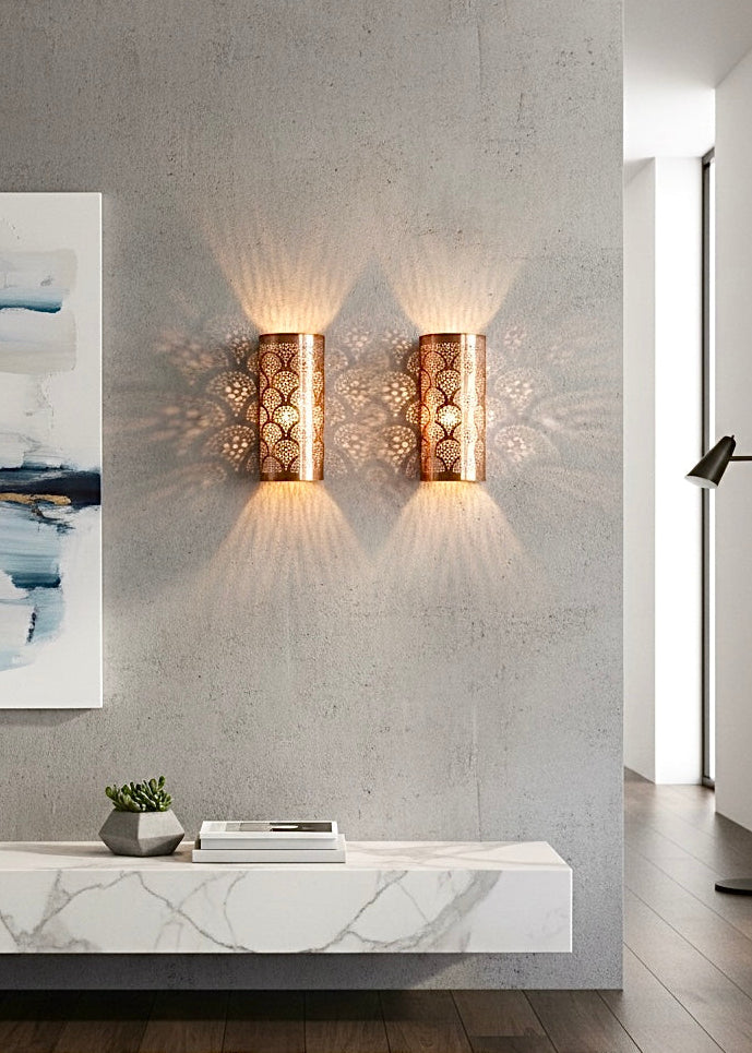 Antique brass wall light featuring traditional Moroccan etching for a warm vintage atmosphere.