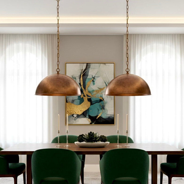 Antique-style red brass dome lamp providing warm farmhouse ambient lighting.