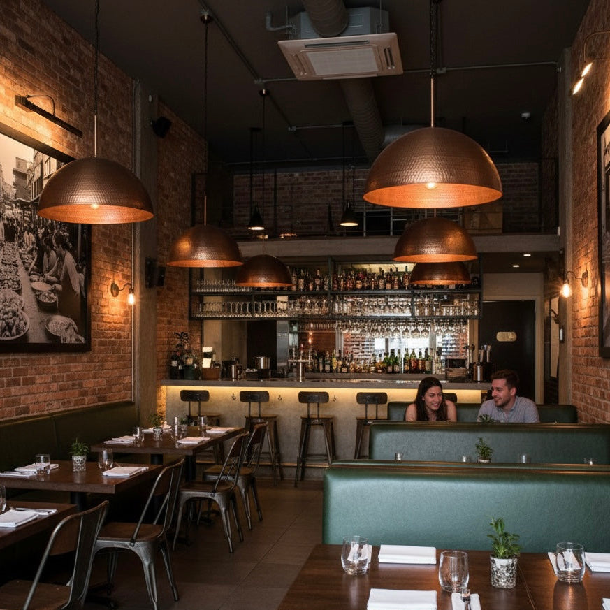 Artisan-crafted copper pendant light showing traditional Moroccan hammering techniques.