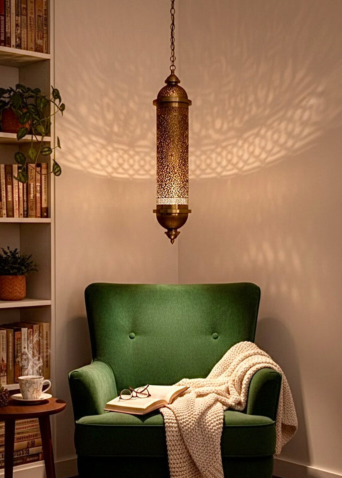 Large Moroccan brass chandelier hanging in a bohemian style living room, creating a cozy and exotic atmosphere.