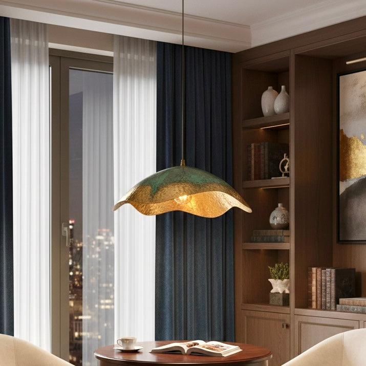 Moroccan dome pendant light hanging over a dining table, rustic bohemian interior design.