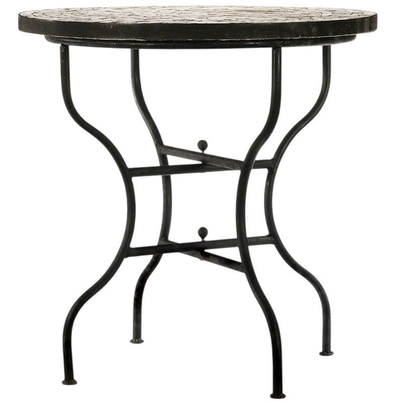 Round boho-style Moroccan mosaic dining table featuring a symmetrical Moorish geometric star pattern.