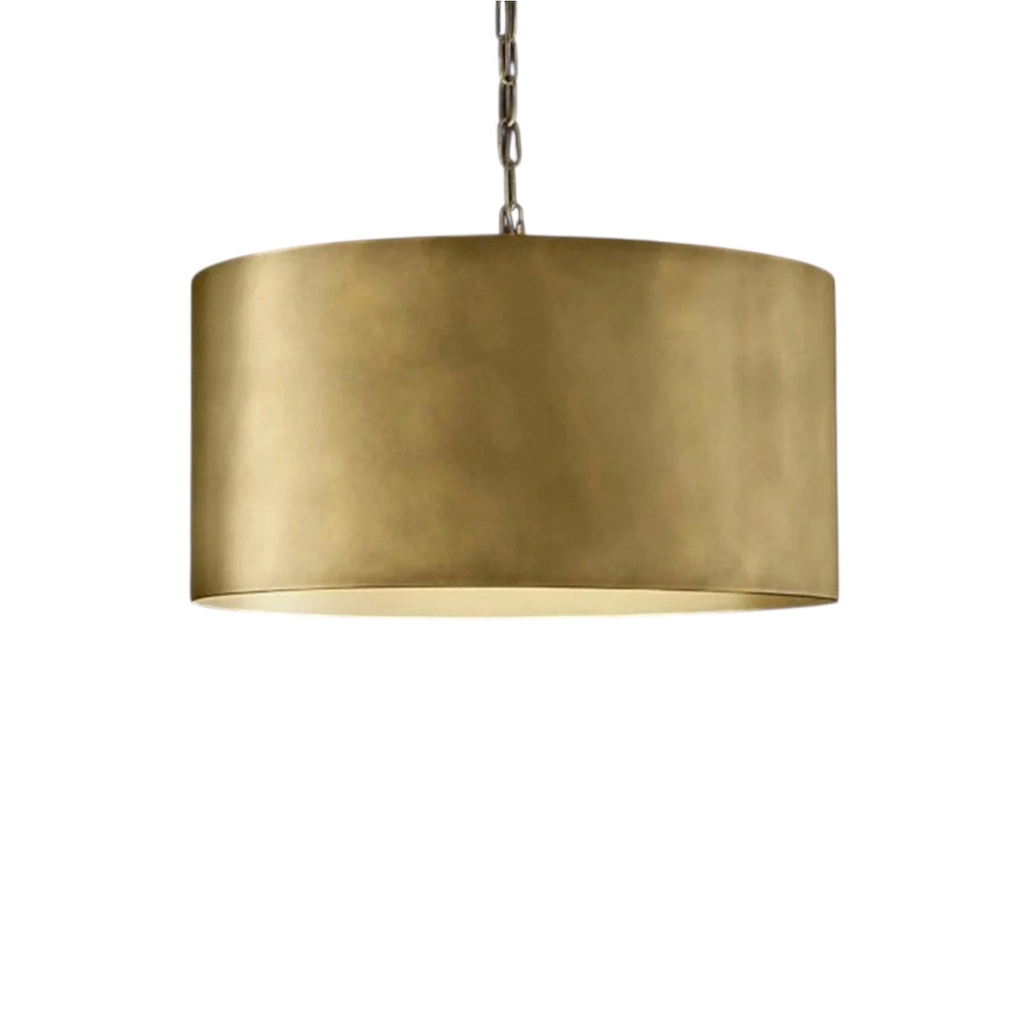 Minimalist brass drum pendant light creating a cozy and stylish atmosphere in a master bedroom.
