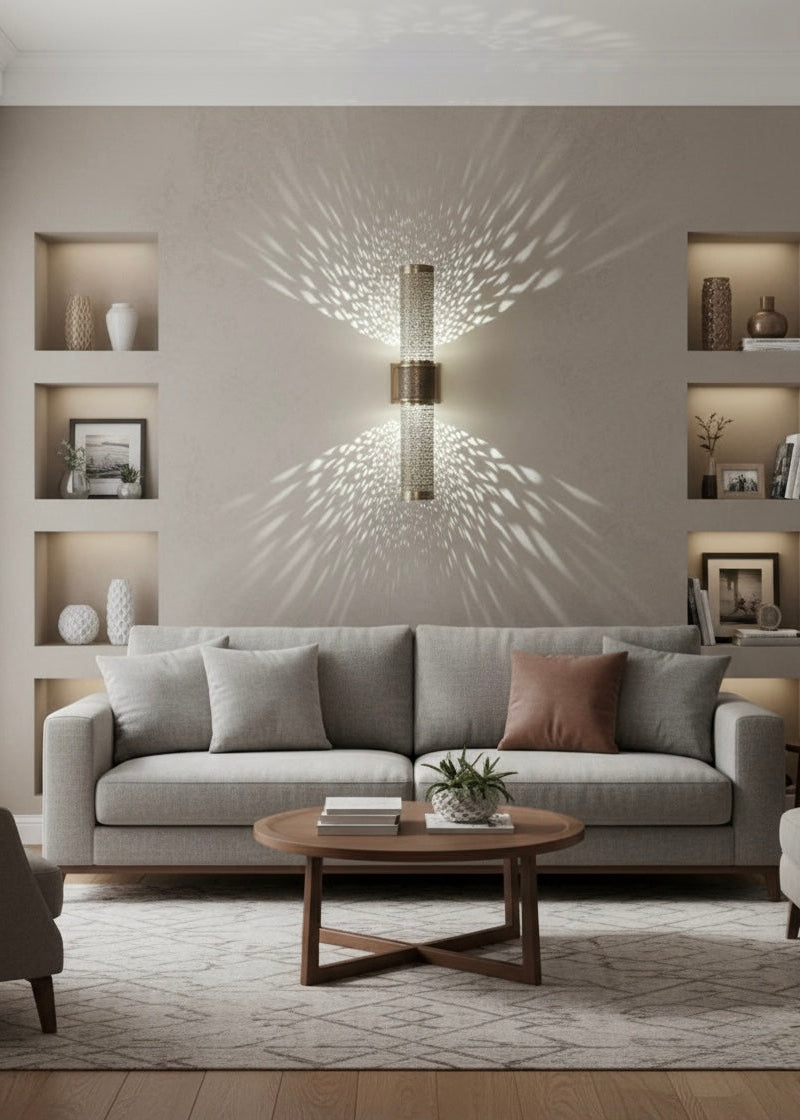 Vertical cylinder Moroccan brass wall sconce with up and down lighting effect for hallways.