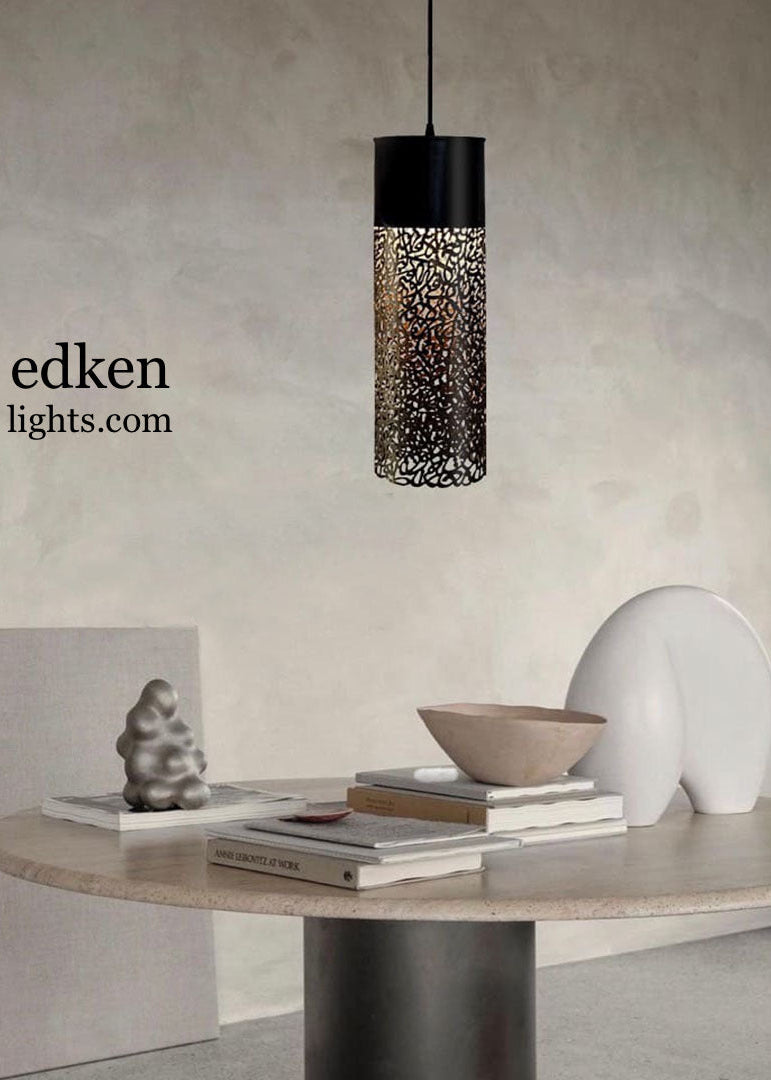 Full-length view of a tall cylindrical Moroccan brass lantern with golden tones and artistic metal engravings.