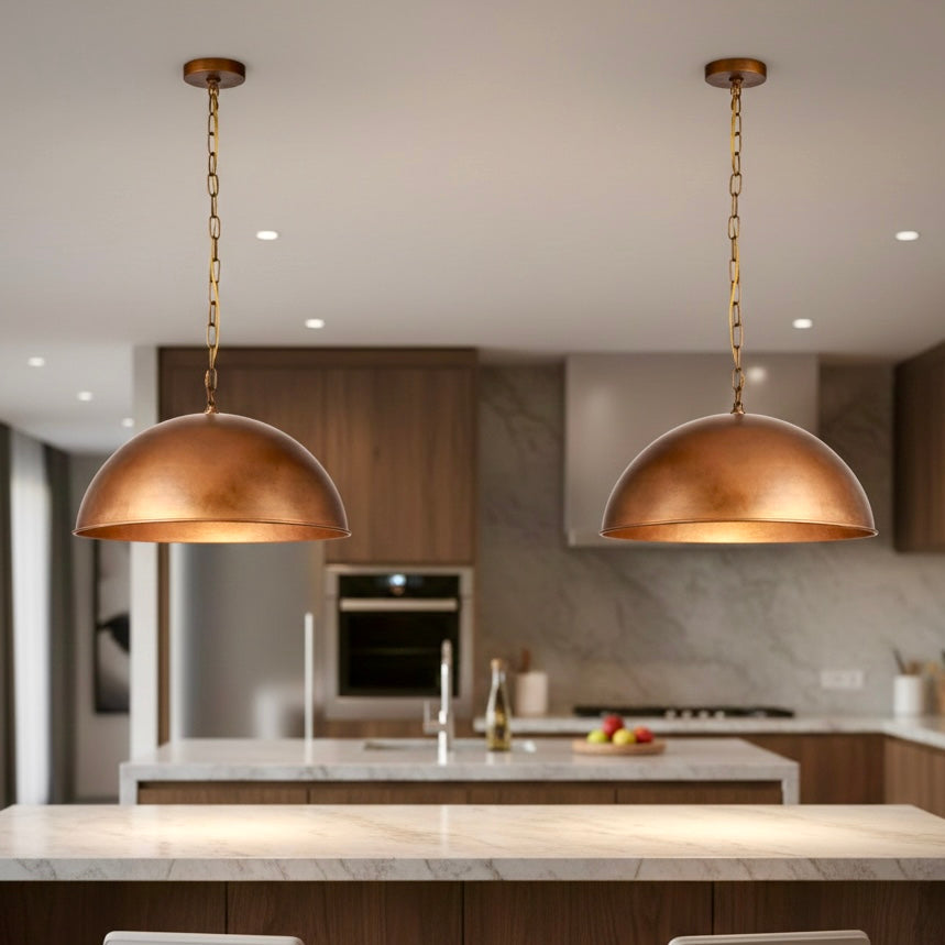 Rustic farmhouse style red copper dome pendant for vintage kitchen decor.