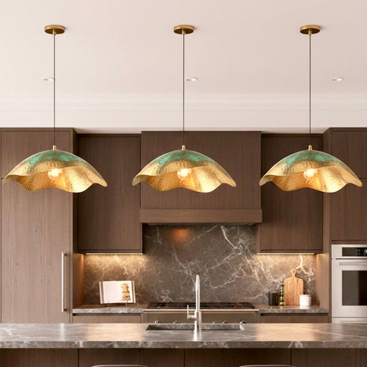 Interior view of Moroccan brass lamp showing golden hammered texture for warm lighting.
