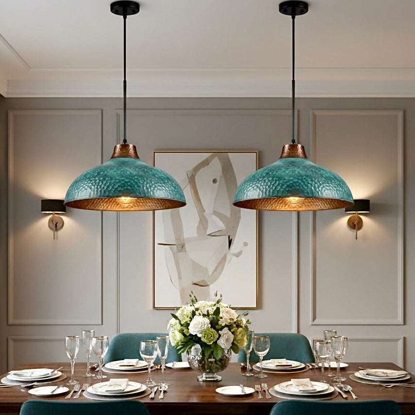 Modern rustic green verdigris lamp casting a warm golden light in a designer room.