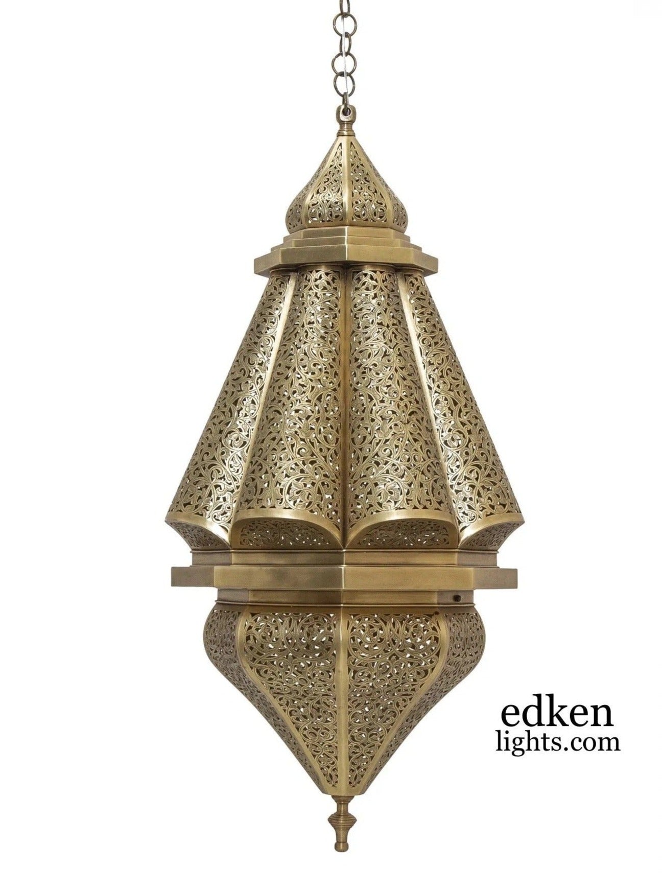 Close-up of hand-carved details on a traditional Moroccan brass lamp.