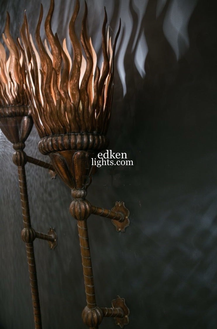 Close-up of handmade Moroccan brass engraving on a wall lamp.