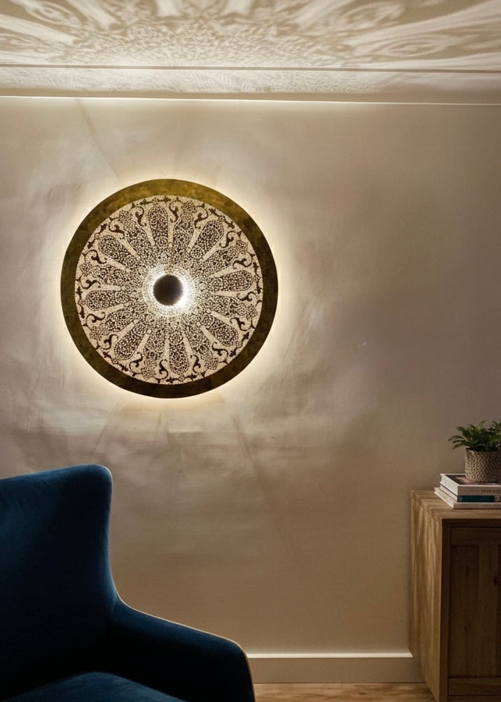Authentic Moroccan brass lighting fixture featuring hand-etched radial designs for wall decor.