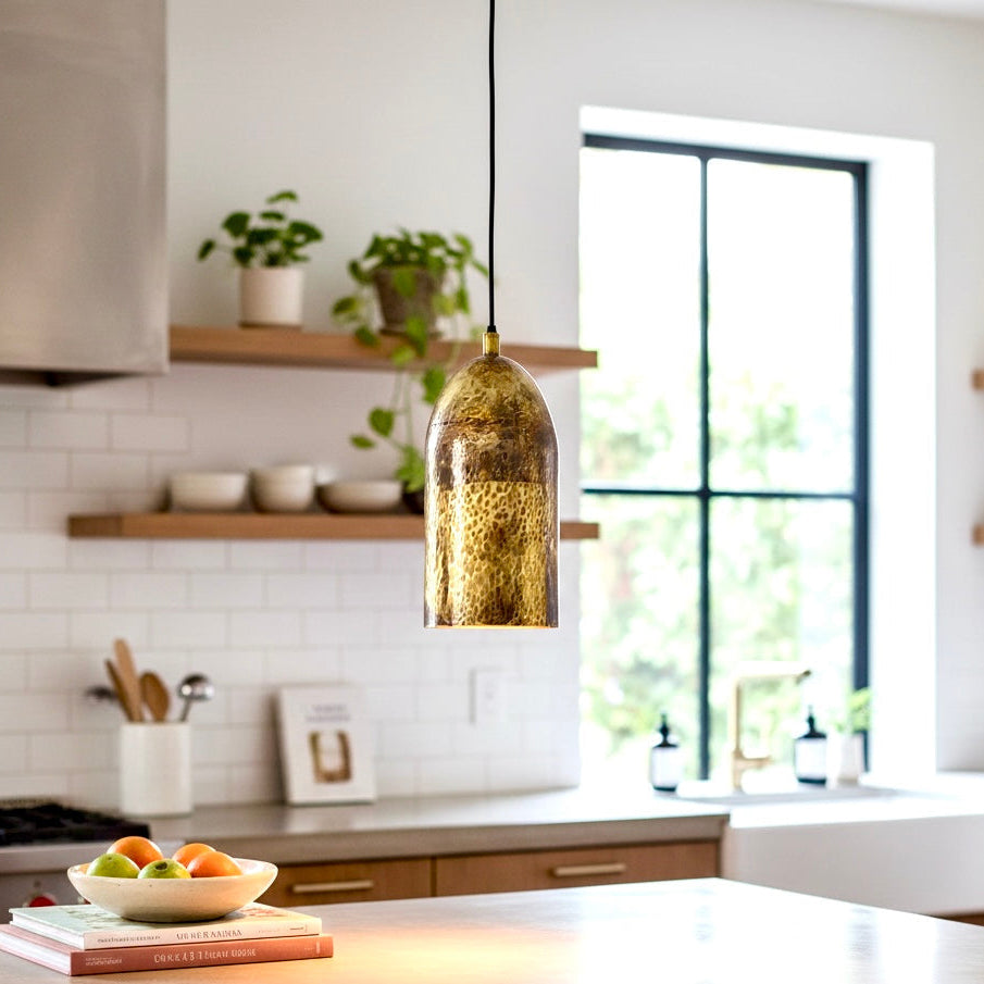 Moroccan handmade brass dome light fixture in a modern white kitchen with open shelving.