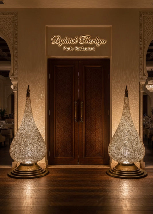 Detailed hand-pierced floral lattice work on a traditional Moroccan brass lantern.