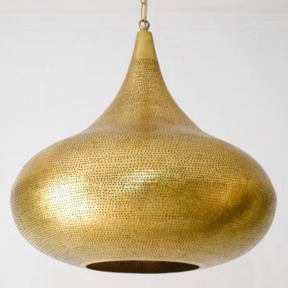 Detailed view of hand-perforated brass filigree on a Moroccan hanging lantern, showing craftsmanship.