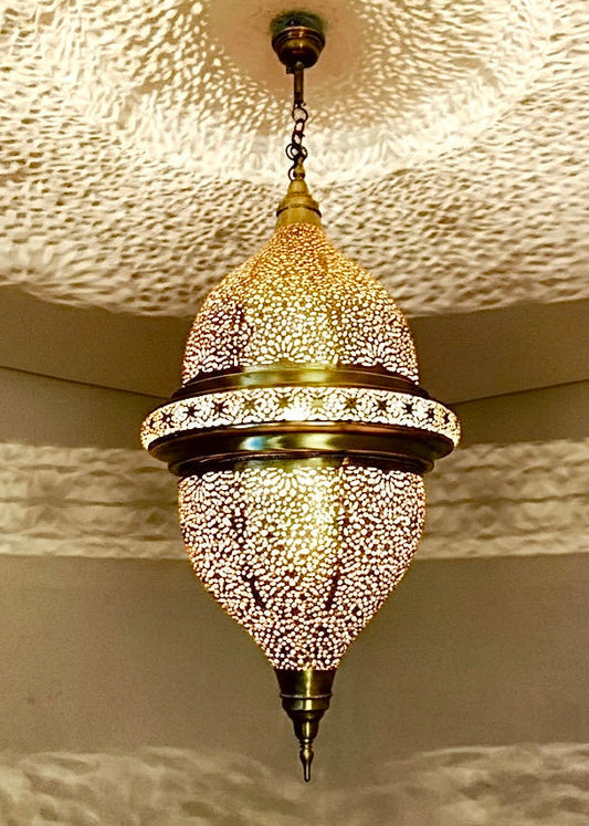 Grand Moroccan brass chandelier featuring traditional hand-perforated floral designs.