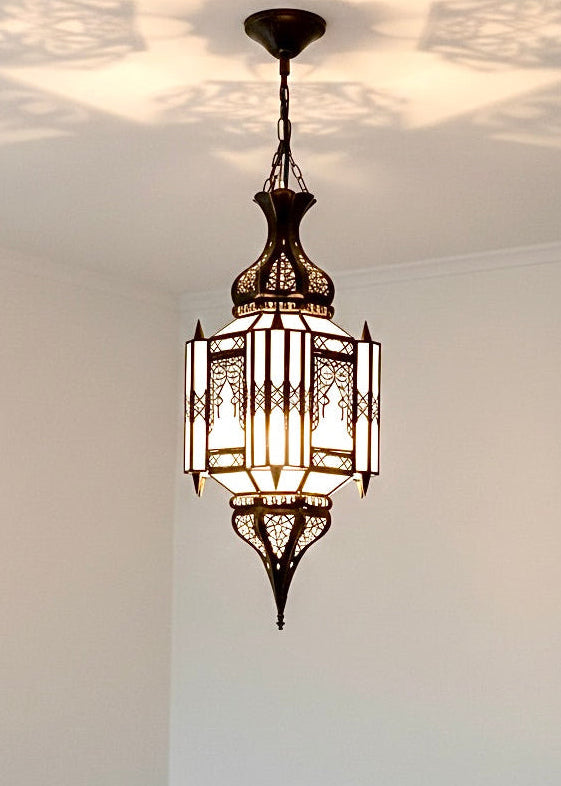 Handmade glass and brass pendant lamp, artisanal lighting with gold finish.