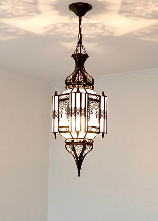 Handmade glass and brass pendant lamp, artisanal lighting with gold finish.