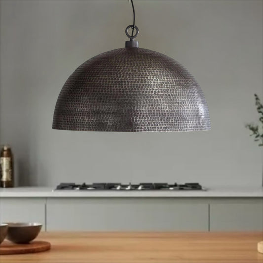 Handmade hammered metal dome pendant light in matte black and gold finish, Moroccan style modern lighting.