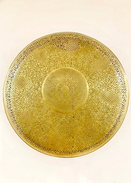 Close-up of a handmade Moroccan brass flush mount ceiling light featuring intricate hand-engraved geometric patterns, 100% solid brass craftsmanship.