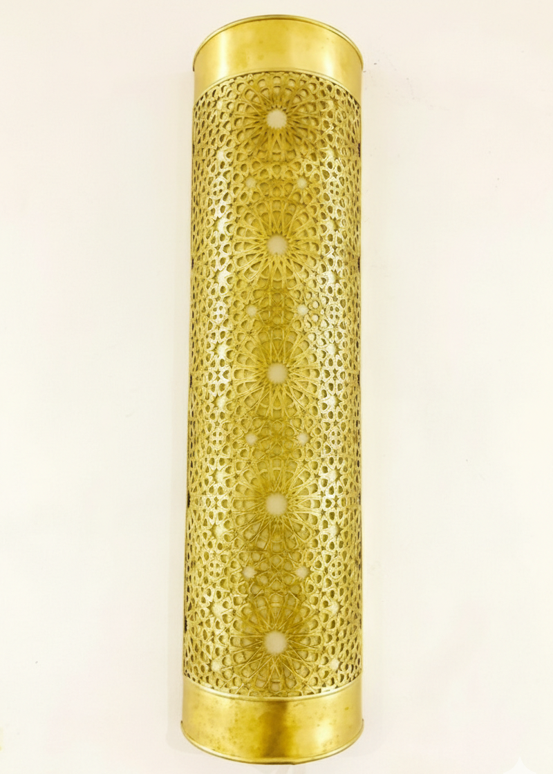 Handmade Moroccan brass wall lamp with intricate hand-pierced patterns.
