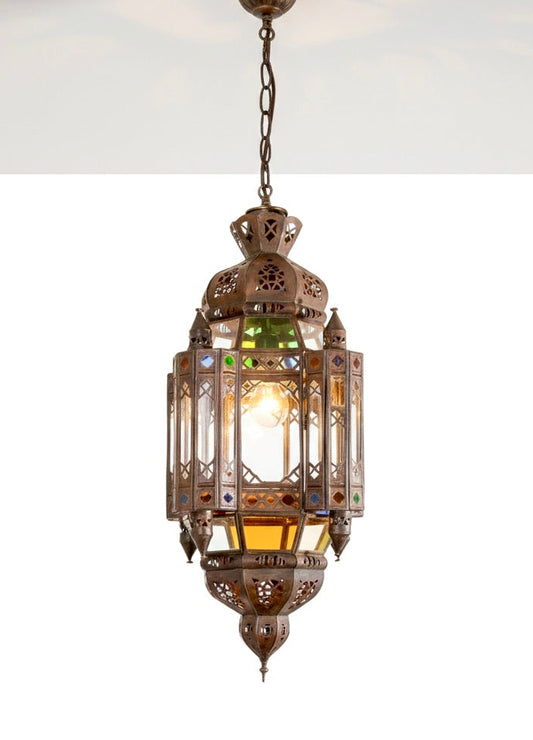 Close-up of an authentic handcrafted Moroccan lantern featuring intricate brass metalwork and multicolored stained glass inserts.