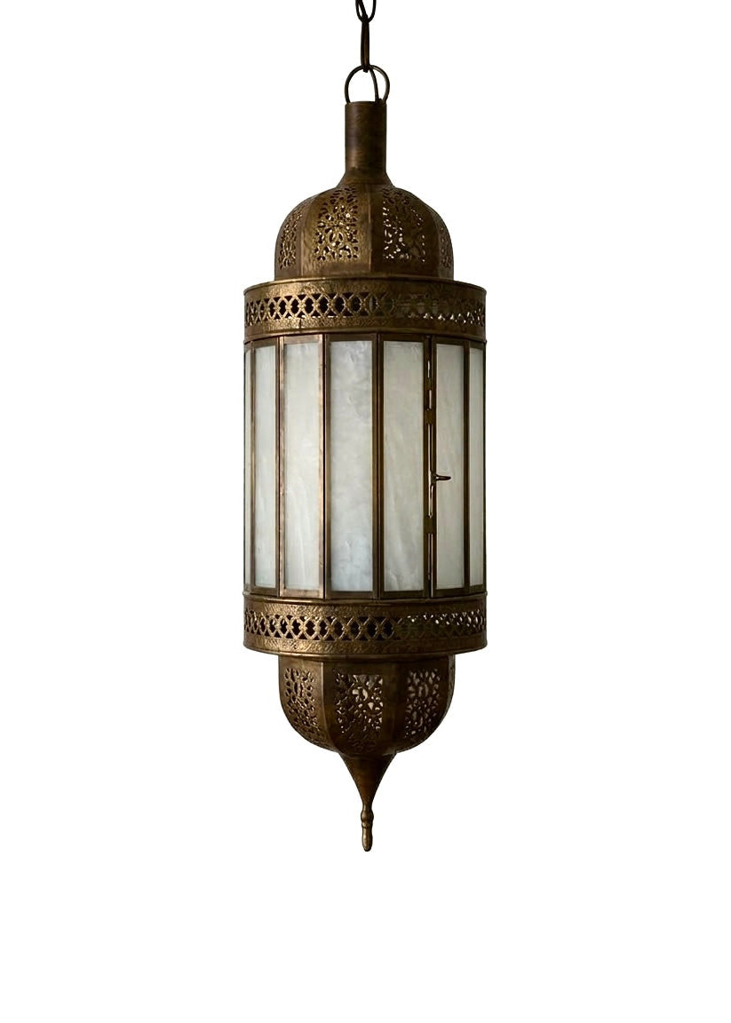 A handcrafted Moroccan lantern made of solid brass and frosted glass panels, featuring intricate hand-pierced geometric metalwork.
